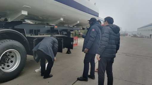 The customer is inspecting the completed semi-trailer