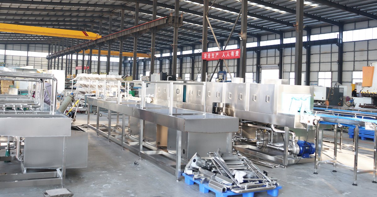 Henger Technology crate washing machine installed in overseas meat processing plant showing automated container sanitation workshop real shot