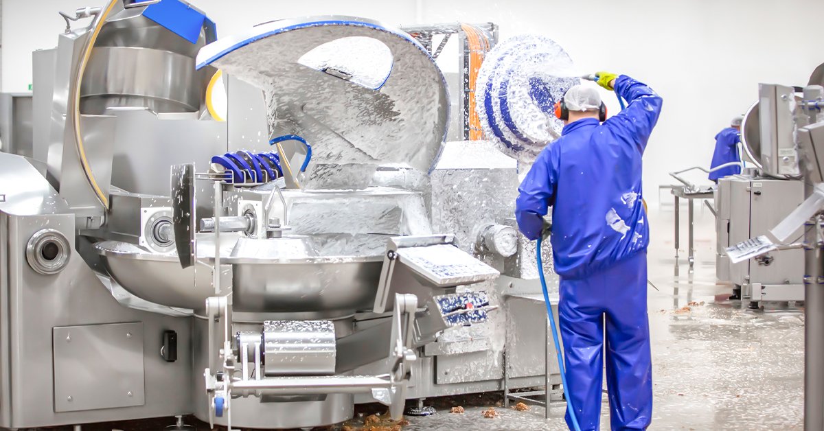 Henger Technology foam cleaning system installed in overseas slaughterhouse showing foam application on processing equipment workshop real shot