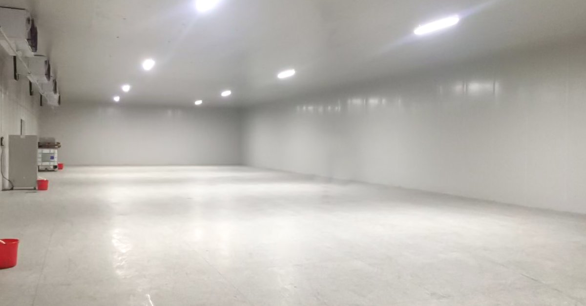 Henger Technology blast freezer installed in overseas slaughterhouse showing loaded freezing trolleys and temperature monitoring system workshop real shot