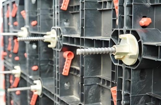 Why is the tuning mass damper set at the top and not at the bottom? Isn't the bottom lower and more stable with a low center of gravity?