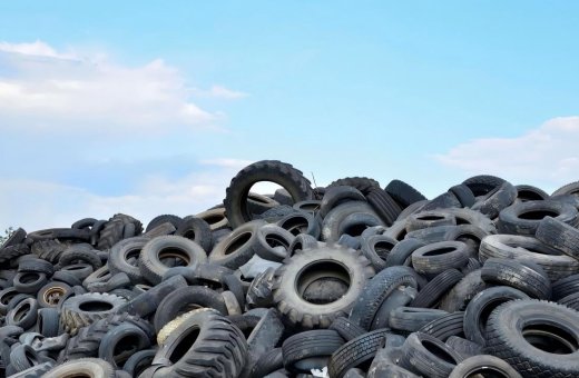 What is the use of a layer of tires embedded in Americans when building roads? Why doesn't China follow suit?