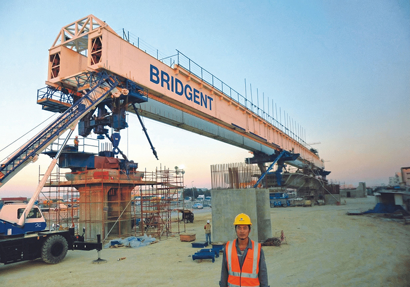 Bridgent launching gantry in operation at bridge construction site