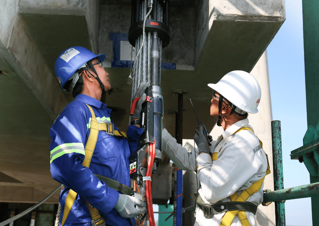 Bridgent engineers installing stay cables on a cable-stayed bridge structure