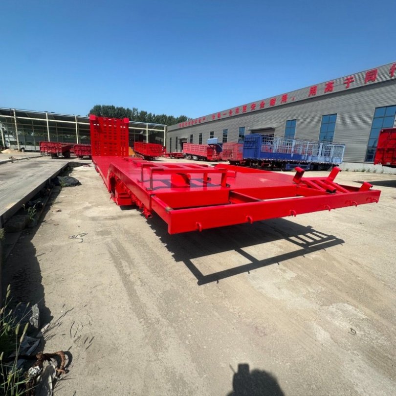 Versatile Low Flatbed Trailer Designed for Safe Heavy Equipment Transportation