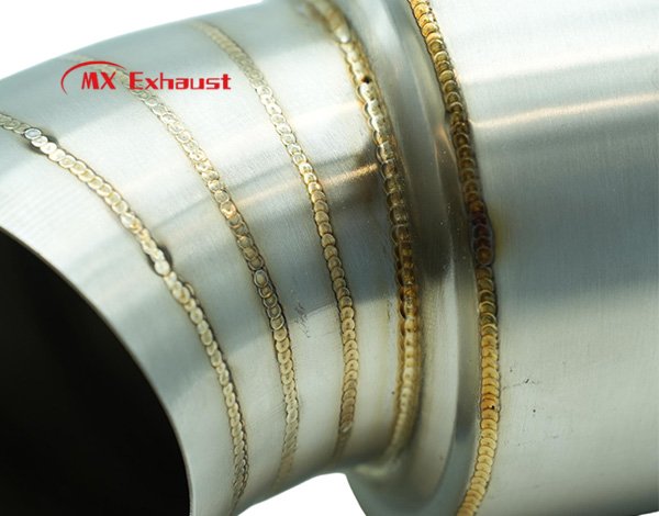 angled outlet exhaust muffler for improved airflow and exhaust direction