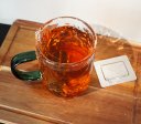 Textured glass tea cup with handle