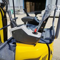 mini excavator maneuvering in narrow space