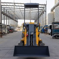 skid loader operating on construction site