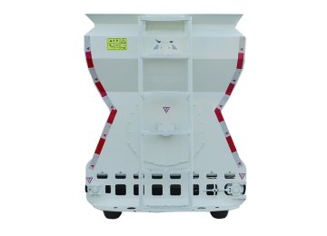 Compact hydraulic feed spreader