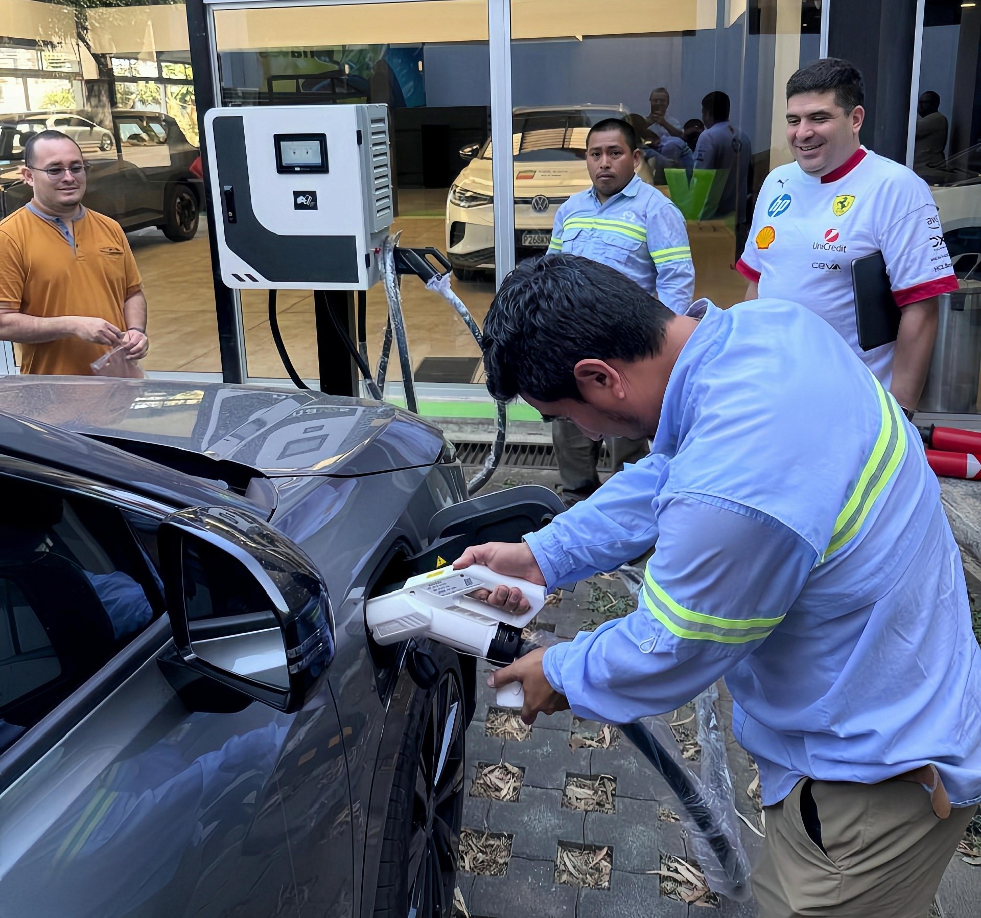 Technical team commissioning Penoda 28kW DC fast charger for electric vehicle in Guatemala City